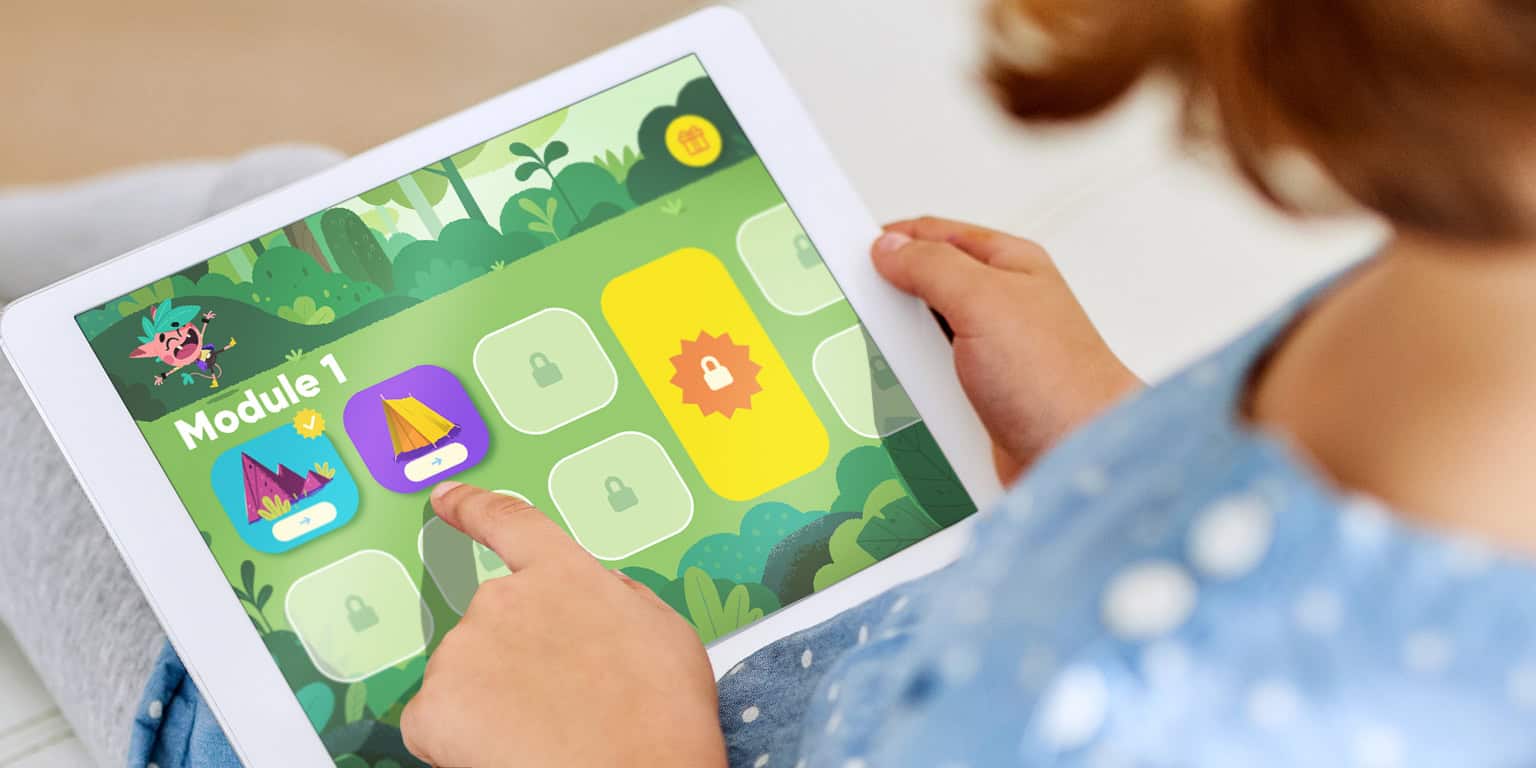 View over the shoulder of a girl playing Chatter Labs Speech Therapy app on her tablet.